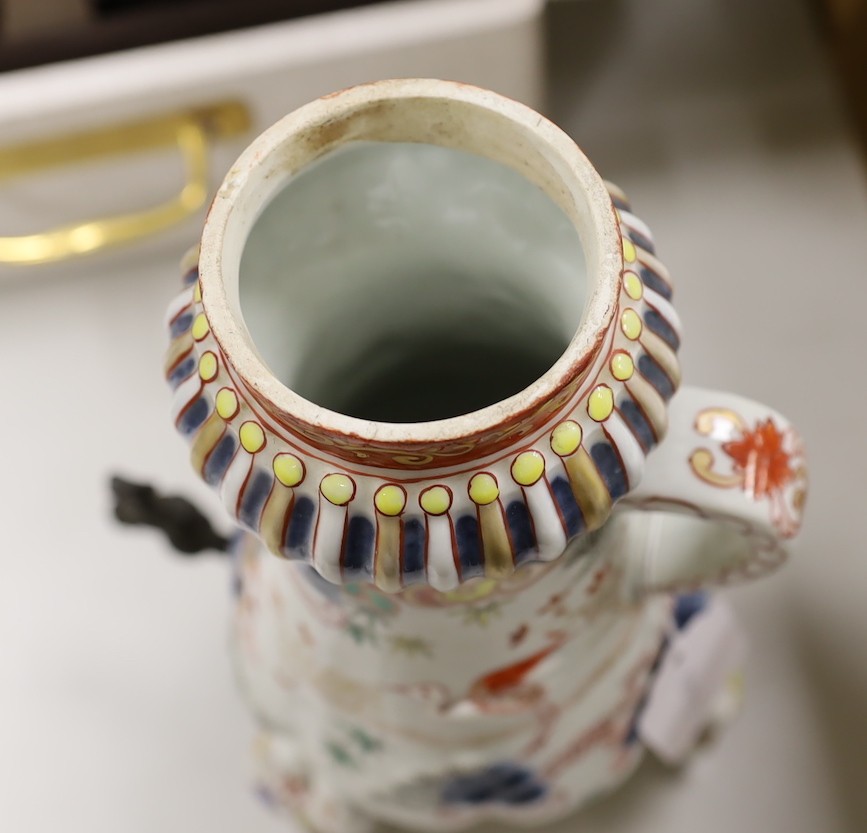 A Japanese Arita or Imari porcelain tripod urn, 29.5 cm high